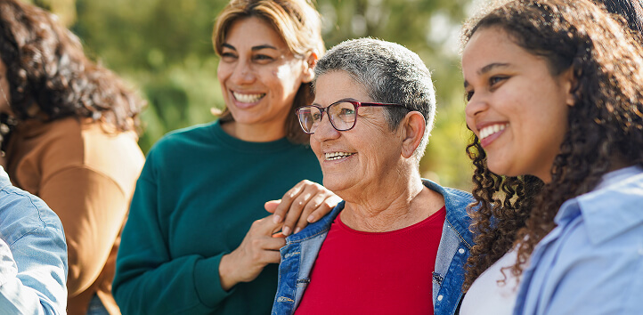 A group of women smiling to someone off-camera
