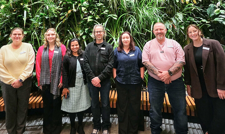 Photo of Outcomes Connect Australia team members, smiling to camera